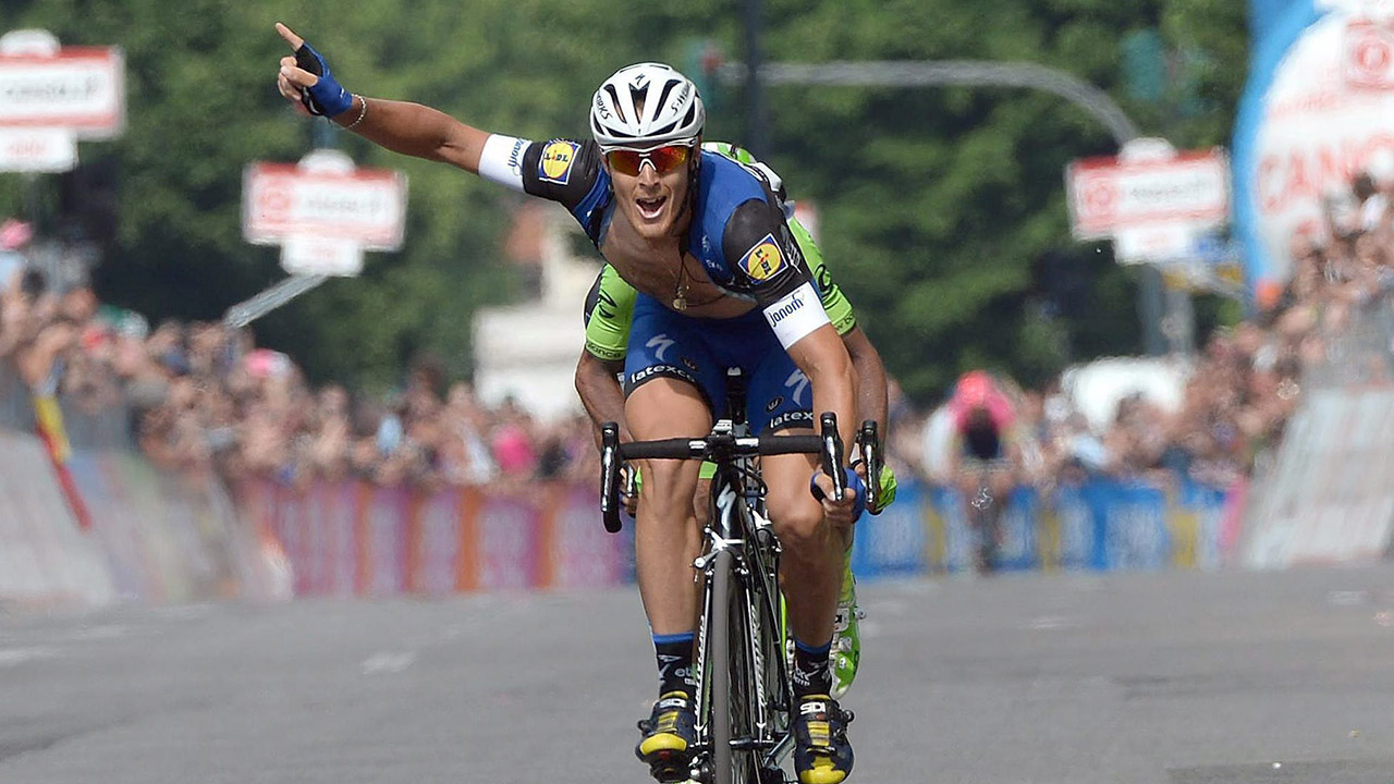 Italy's-Matteo-Trentin-celebrates-as-he-crosses-the-finish-line.-(Luca-Zennaro/AP)