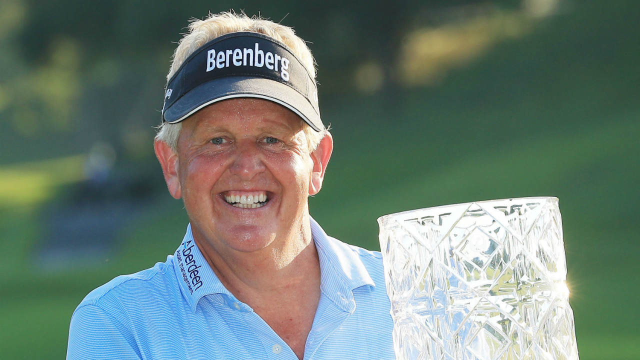 Colin-Montgomerie-of-Scotland-poses-with-the-trophy-after-winning-the-Japan-Airlines-Championship,-the-first-PGA-Tour-Champions-event-in-Japan,-on-Narita-Golf-Club's-greens-in-Chiba,-near-Tokyo,-Sunday,-Sept.-10,-2017.-(Kyodo-News-via-AP)