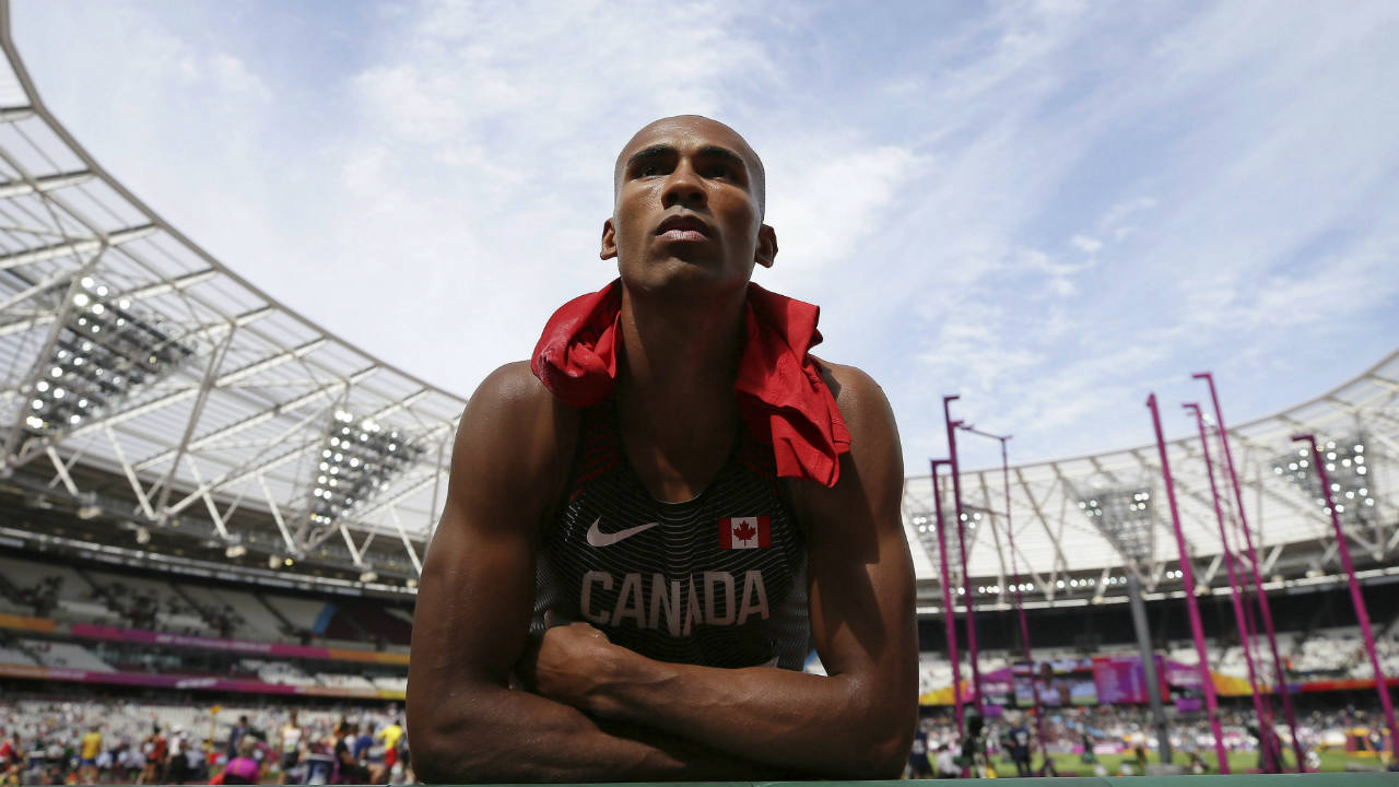 Canada's-Damian-Warner-listens-to-his-coach-in-a-break-in-the-Decathlon-shot-put-during-Men's-high-jump-qualifying-during-the-World-Athletics-Championships-Friday,-Aug.-11,-2017.-(Tim-Ireland/AP)