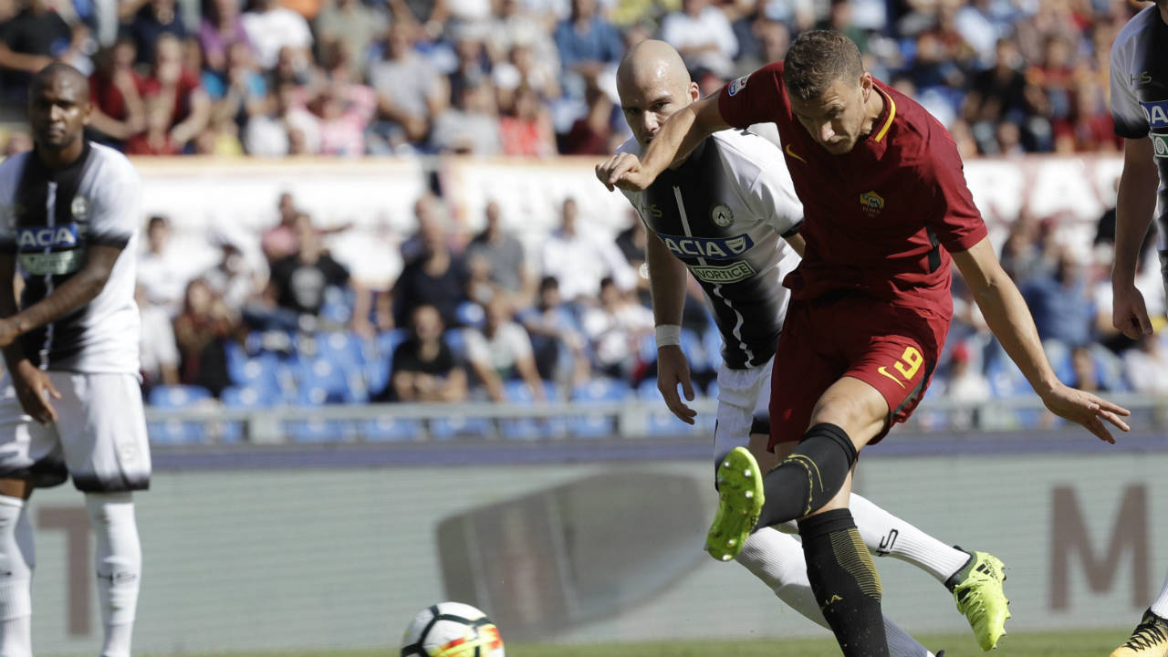 Roma's-Edin-Dzeko-scores-a-goal-during-an-Italian-Serie-A-soccer-match-between-Roma-and-Udinese,-at-the-Olympic-stadium-in-Rome,-Saturday,-Sept.-23,-2017.-(Alessandra-Tarantino/AP)