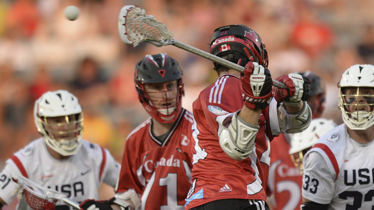 anada-midfielder-Kevin-Crowley-(21)-scores-in-the-first-half-with-a-shot-that-he-made-behind-his-back-against-the-United-States-an-an-FIL-World-Lacrosse-Championship-game.-(The-Denver-Post,-Karl-Gehring/AP)