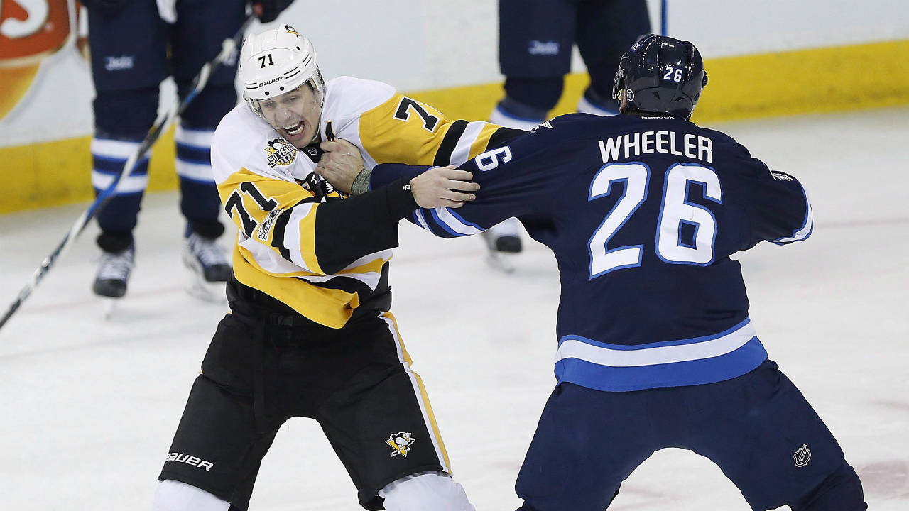Winnipeg-Jets'-Blake-Wheeler-(26)-and-Pittsburgh-Penguins'-Evgeni-Malkin-(71)-get-warmed-up-early-as-Dustin-Byfuglien-(33)-and-Bryan-Little-(18)-look-on-during-first-period-NHL-action,-in-Winnipeg-on-Wednesday,-March-8,-2017.-(John-Woods/CP)