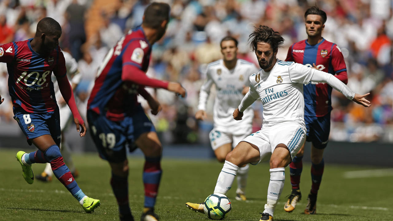 Real-Madrid's-Francisco-Roman-"Isco",-right,-battles-for-the-ball-with-Levante-defenders-during-the-Spanish-La-Liga-soccer-match-between-Real-Madrid-and-Levante-at-the-Santiago-Bernabeu-stadium-in-Madrid,-Saturday,-Sept.-9,-2017.-The-match-ended-in-a-1-1-draw.-(Francisco-Seco/AP)