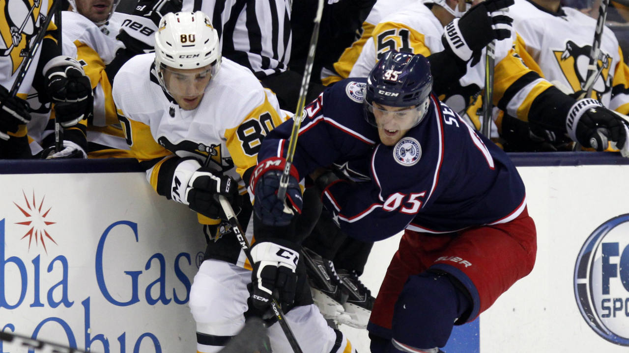 Pittsburgh-Penguins-forward-Sam-Miletic,-left,-works-for-the-puck-against-Columbus-Blue-Jackets-forward-Lukas-Sedlak,-of-the-Czech-Republic,-during-the-first-period-of-a-preseason-NHL-hockey-game-in-Columbus,-Ohio,-Friday,-Sept.-22,-2017.-(Paul-Vernon/AP)