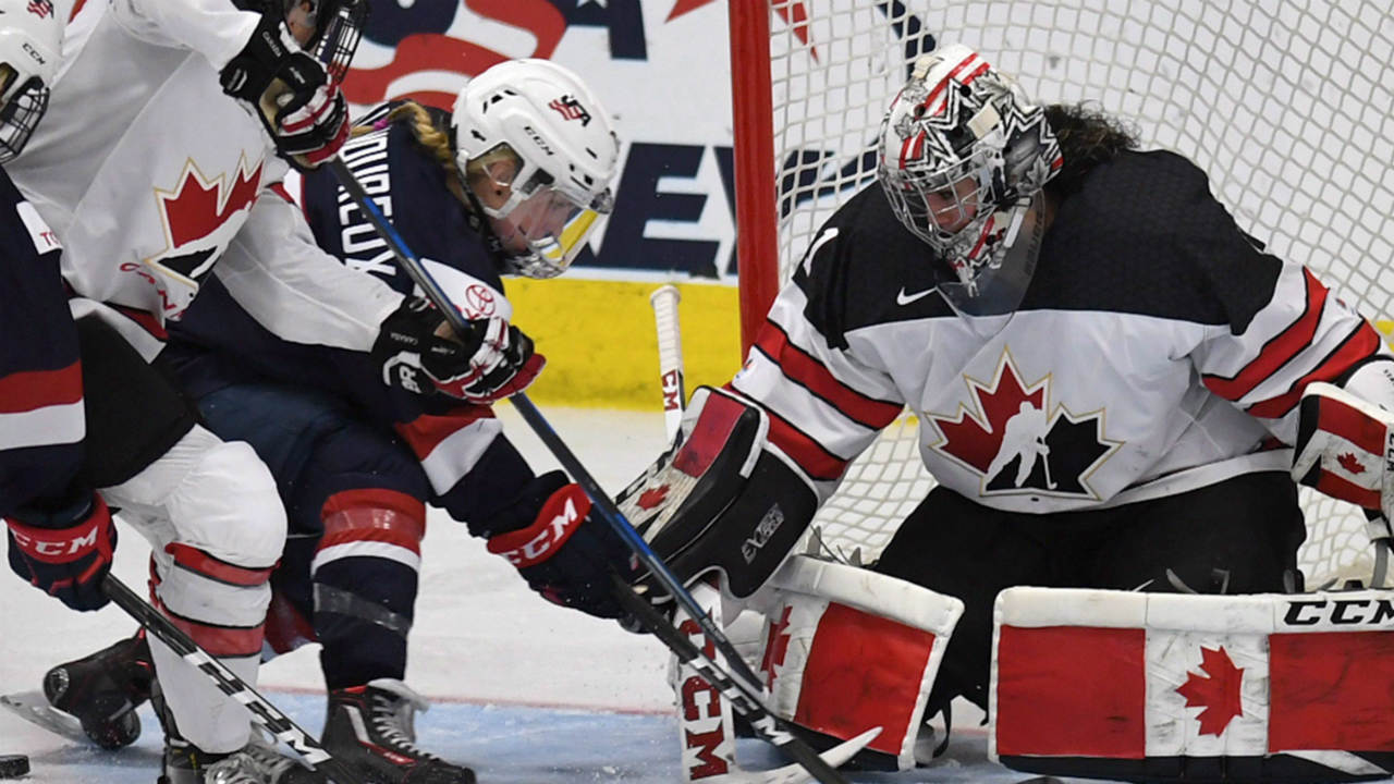 Canada-goalie-Shannon-Szabados-makes-save-against-the-United-State's-Jocelyne-Lamoureux-Davidson-during-the-IIHF-Ice-Hockey-Women's-World-Championship-gold-medal-game-in-Plymouth,-Mich.,-on-Friday,-April-7,-2017.-(Jason-Kryk/CP)