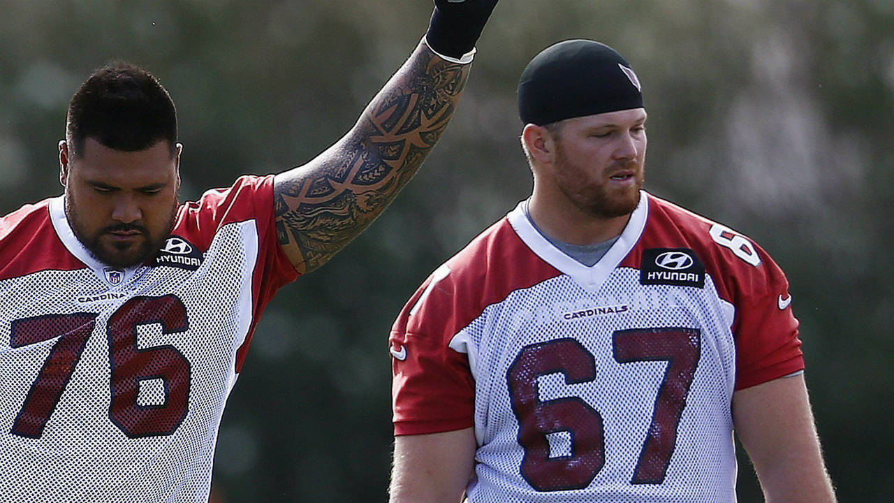 Arizona-Cardinals-offensive-linemen-Mike-Iupati-(76)-and-Tony-Bergstrom-(67)-wait-their-turn-to-run-drills-during-an-NFL-football-organized-team-activity,-Thursday,-June-1,-2017,-at-the-team-training-facility-in-Tempe,-Ariz.-(Ross-D.-Franklin/AP)