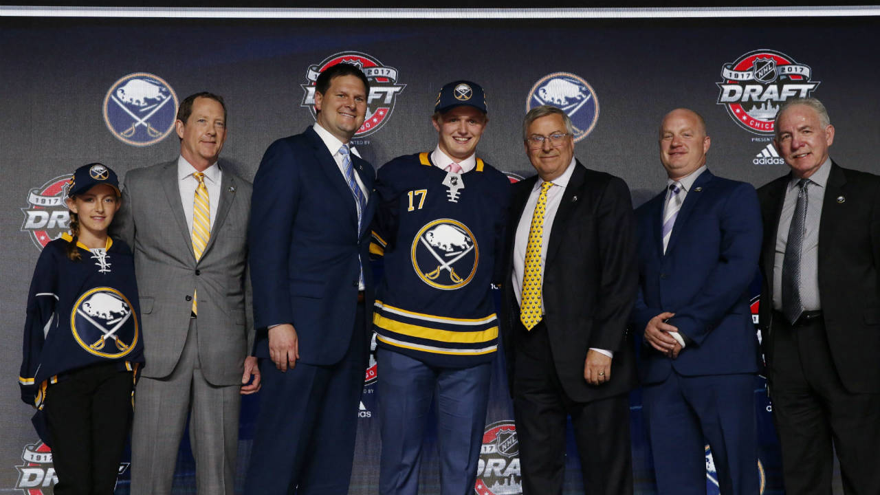Casey-Mittelstadt,-center,-holds-a-Buffalo-Sabres-jersey-after-being-selected-by-the-team-in-the-first-round-of-the-NHL-hockey-draft,-Friday,-June-23,-2017,-in-Chicago.-(Nam-Y.-Huh/AP)