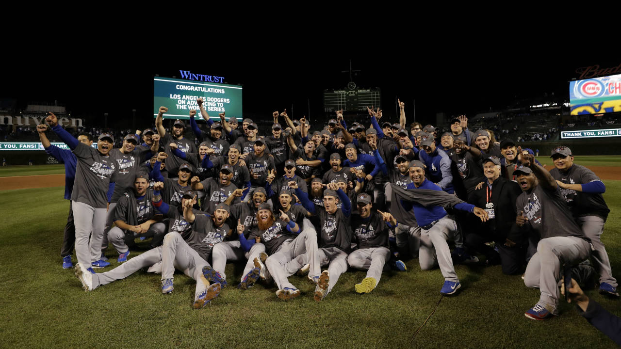 The-Los-Angeles-Dodgers-players-celebrate-after-Game-5-of-baseball's-National-League-Championship-Series-against-the-Chicago-Cubs,-Thursday,-Oct.-19,-2017,-in-Chicago.-The-Dodgers-won-11-1-to-win-the-series-and-advance-to-the-World-Series.-(Matt-Slocum/AP)