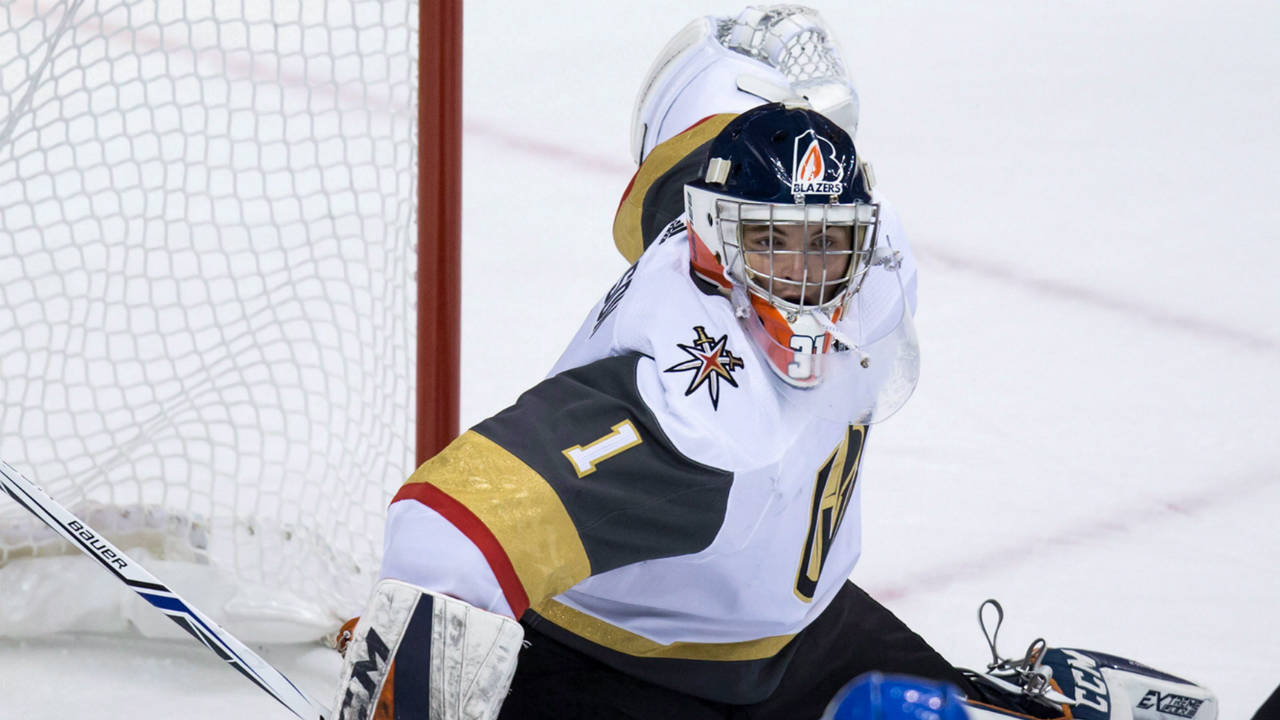 Vegas-Golden-Knights'-goalie-Dylan-Ferguson-stops-Vancouver-Canucks'-Kole-Lind-during-the-third-period-of-a-preseason-NHL-hockey-game-in-Vancouver,-B.C.,-on-Sunday-September-17,-2017.-(Darryl-Dyck/CP)