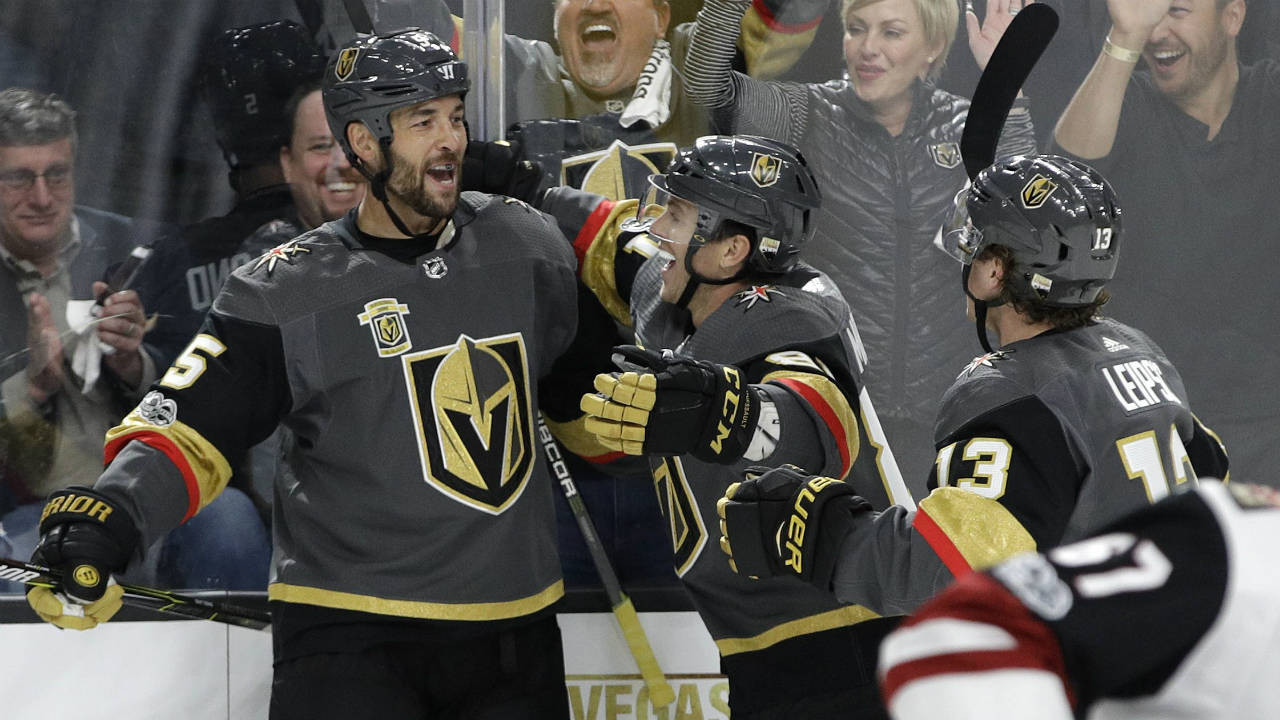 Vegas-Golden-Knights-defenceman-Deryk-Engelland,-left,-celebrates-after-scoring-against-the-Arizona-Coyotes-during-the-first-period-of-an-NHL-hockey-game-Tuesday,-Oct.-10,-2017,-in-Las-Vegas.-(John-Locher/AP)