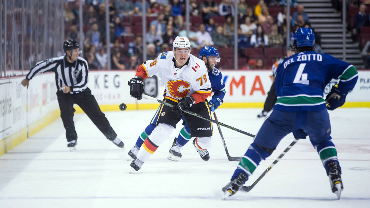 Calgary-Flames'-Micheal-Ferland-(79)-shoots-the-puck-past-Vancouver-Canucks'-Michael-Del-Zotto-(4)-during-the-first-period-of-a-preseason-NHL-hockey-game-in-Vancouver,-B.C.,-on-Thursday-September-28,-2017.-(Darryl-Dyck/CP)