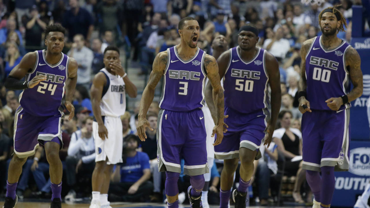 Sacramento-Kings-guard-George-Hill-(3)-reacts-to-scoring-basket-as-teammates-Buddy-Hield-(24),-Zach-Randolph-(50)-and-Willie-Cauley-Stein-(00)-follow-during-the-second-half-of-an-NBA-basketball-game-against-the-Dallas-Mavericks-in-Dallas,-Friday,-Oct.-20,-2017.-The-Kings-won-93-88.-(LM-Otero/AP)