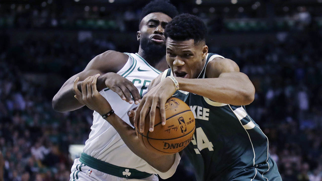 Milwaukee-Bucks-forward-Giannis-Antetokounmpo,-right,-tries-to-drive-past-Boston-Celtics-forward-Jaylen-Brown,-left,-during-the-first-quarter-of-an-NBA-basketball-game,-Wednesday,-Oct.-18,-2017,-in-Boston.-(Charles-Krupa/AP)