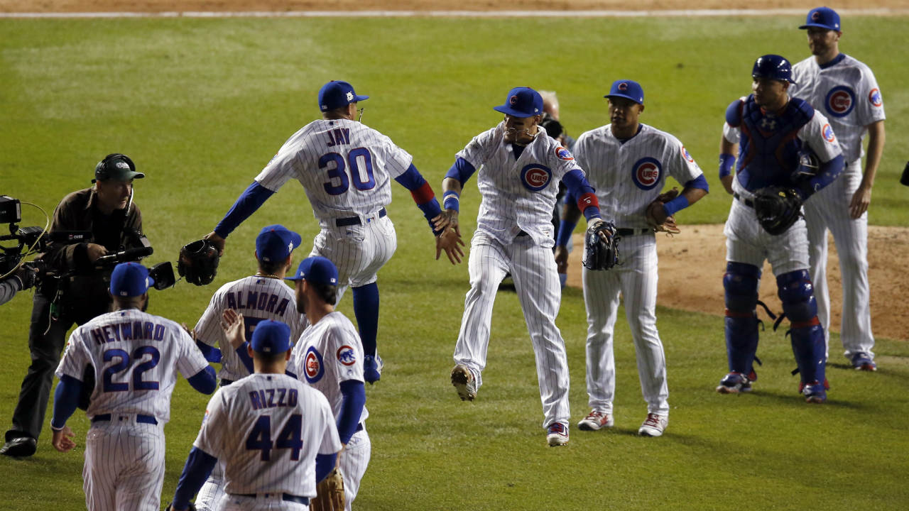 Chicago-Cubs'-Jon-Jay-(30)-and-Javier-Baez-celebrate-after-Game-4-of-baseball's-National-League-Championship-Series-against-the-Los-Angeles-Dodgers,-Wednesday,-Oct.-18,-2017,-in-Chicago.-The-Cubs-won-3-2.-(Charles-Rex-Arbogast/AP)