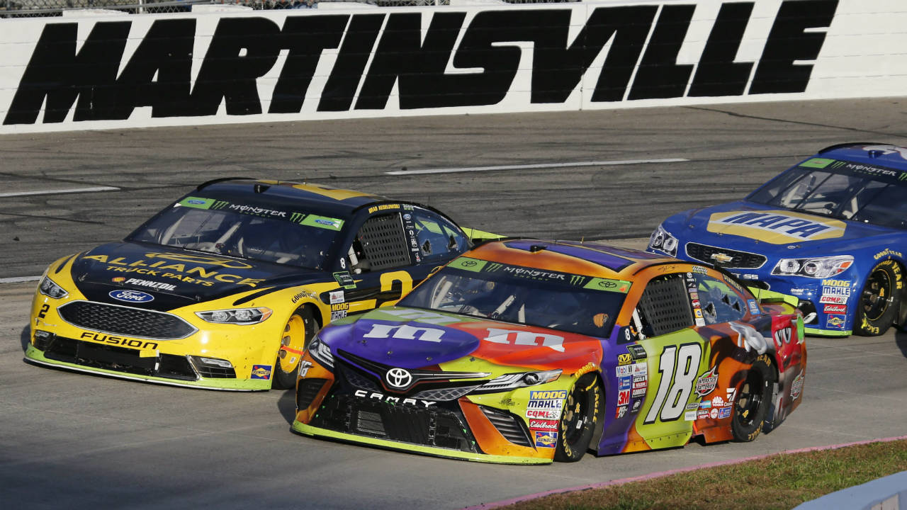 Kyle-Busch-(18)-and-Brad-Keselowski-(2)-lead-the-field-on-a-restart-during-the-third-stage-of-the-NASCAR-Cup-series-auto-race-at-Martinsville-Speedway-in-Martinsville,-Va.,-Sunday,-Oct.-29,-2017.-(Steve-Helber/AP)