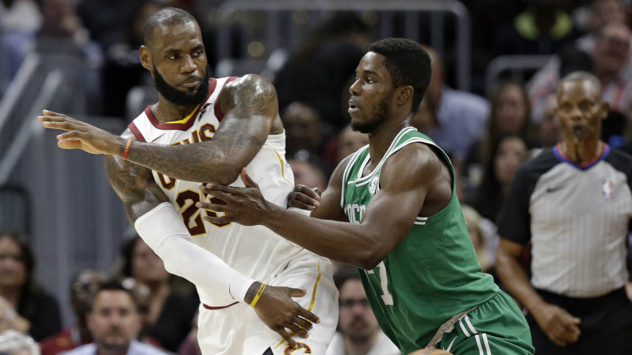 Cleveland-Cavaliers'-LeBron-James,-left,-passes-against-Boston-Celtics'-Semi-Ojeleye-in-the-first-half-of-an-NBA-basketball-game,-Tuesday,-Oct.-17,-2017,-in-Cleveland.-(Tony-Dejak/AP)