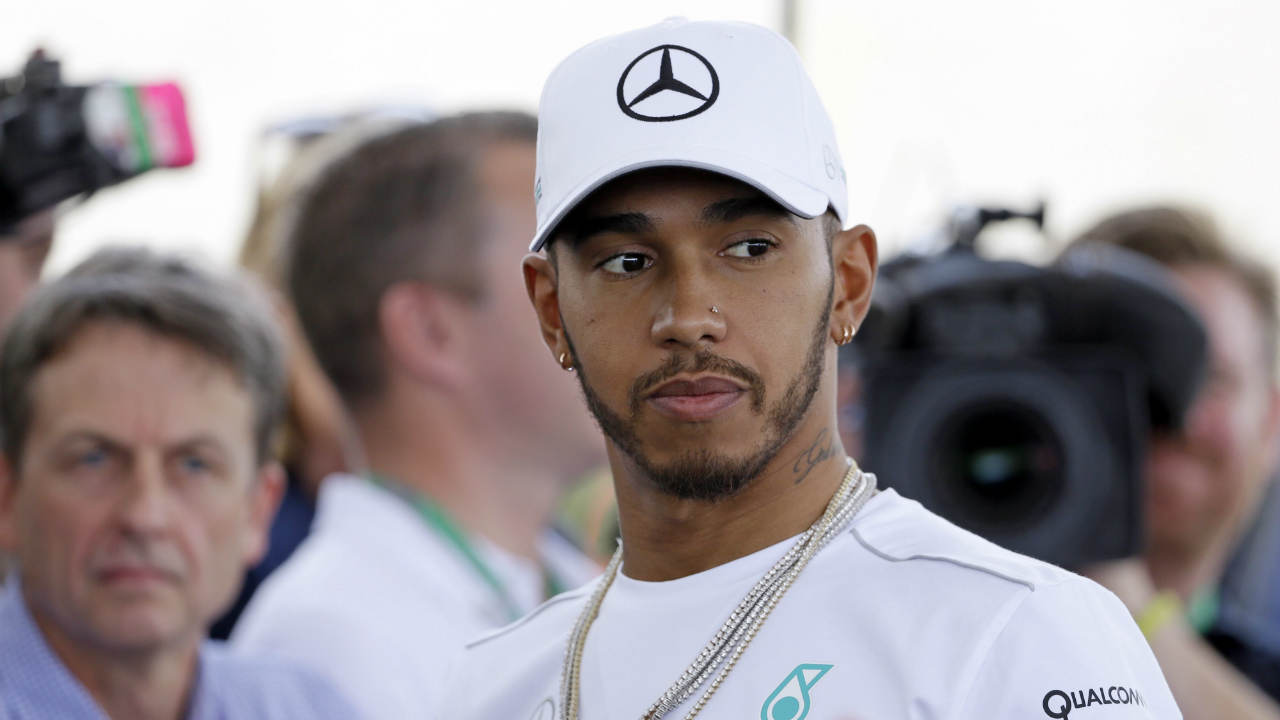 Mercedes-driver-Lewis-Hamilton,-of-Britain,-listens-to-a-question-during-a-news-conference-for-the-Formula-One-U.S.-Grand-Prix-auto-race-at-the-Circuit-of-the-Americas,-Thursday,-Oct.-19,-2017,-in-Austin,-Texas.-(Tony-Gutierrez/AP)