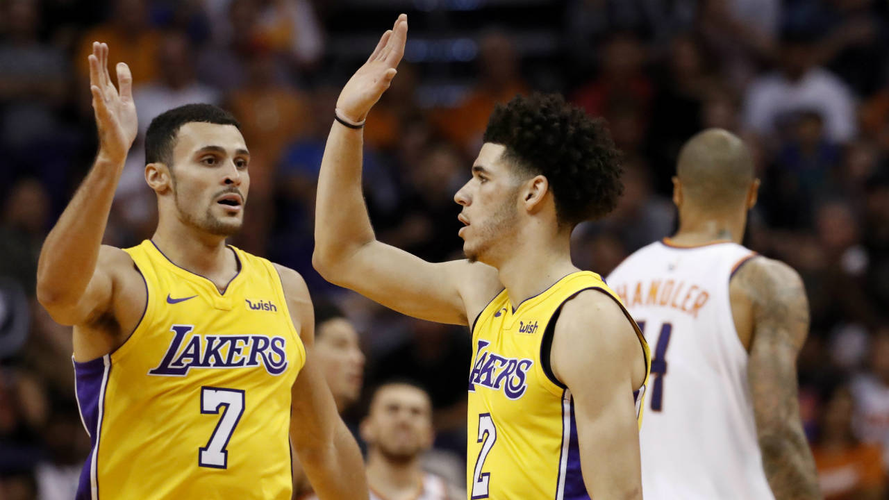 Los-Angeles-Lakers-guard-Lonzo-Ball-(2)-and-forward-Larry-Nance-Jr.-(7)-high-five-during-the-second-half-of-an-NBA-basketball-game-against-the-Phoenix-Suns,-Friday,-Oct.-20,-2017,-in-Phoenix.-(Matt-York/AP)