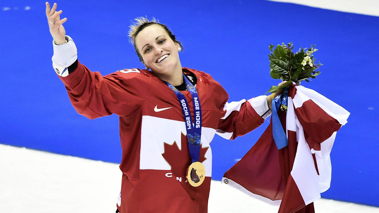 Canada's-Marie-Philip-Poulin-waves-the-crowd-after-scoring-the-game-winning-goal-to-defeat-the-United-States-in-overtime-in-gold-medal-women's-hockey-final-at-the-2014-Sochi-Winter-Olympics.-(Nathan-Denette/CP)