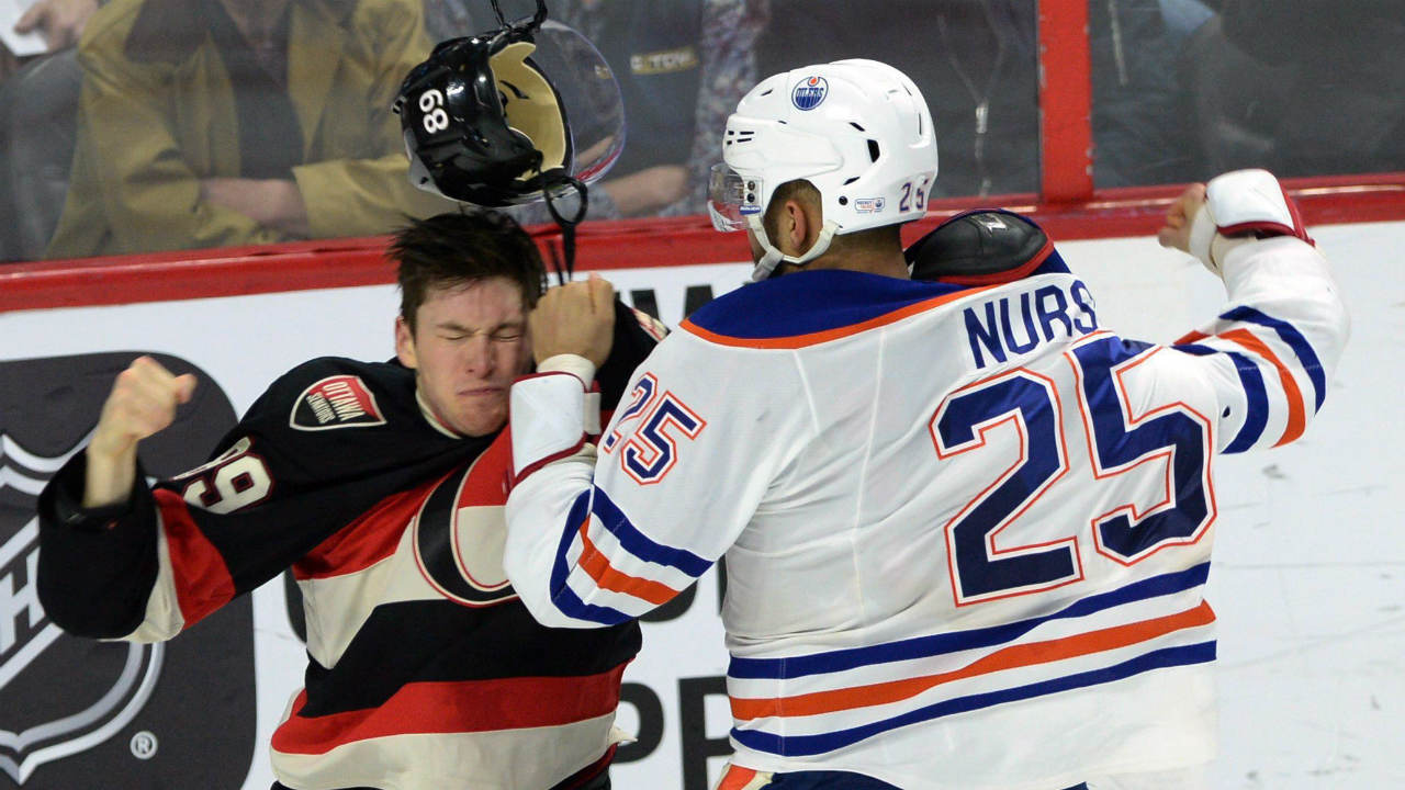 Edmonton-Oilers'-Darnell-Nurse-fights-with-Ottawa-Senators'-Max-McCormick.-(Sean-Kilpatrick/CP)