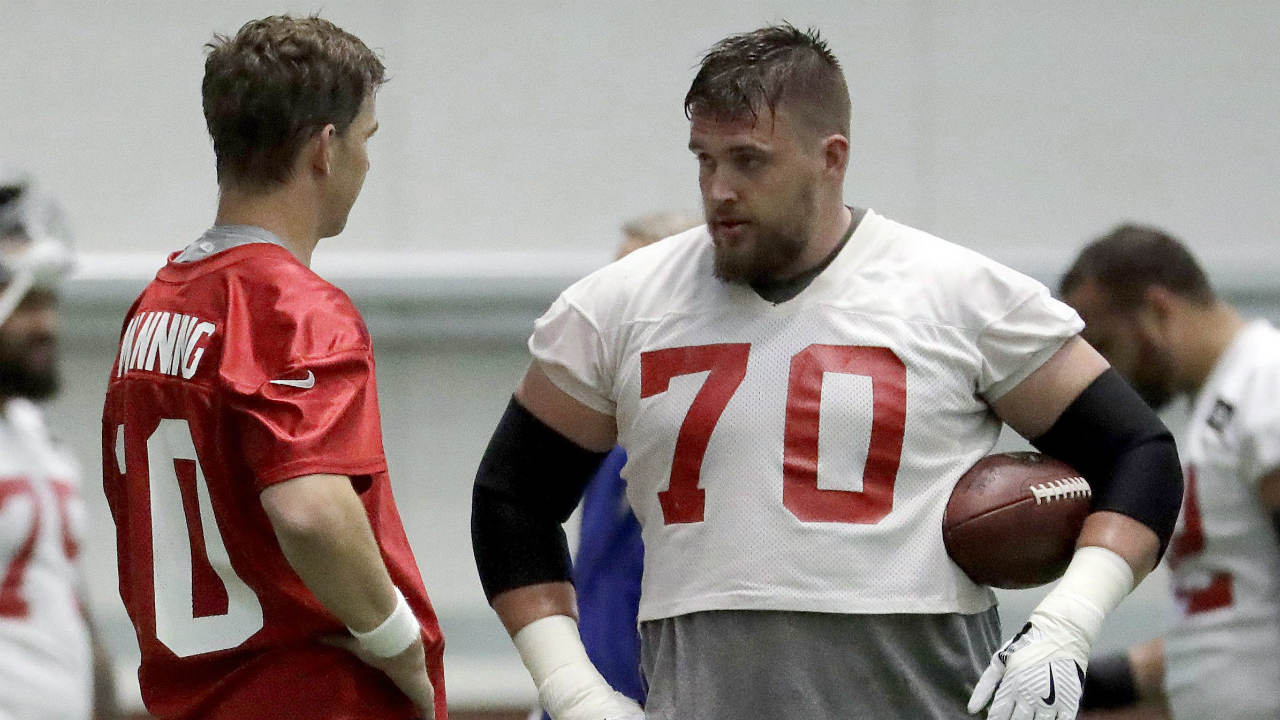 New-York-Giants-centre-Weston-Richburg,-right,-talks-to-quarterback-Eli-Manning-during-the-team's-organized-team-activities-at-its-NFL-football-training-facility,-Thursday,-May-25,-2017,-in-East-Rutherford,-N.J.-(Julio-Cortez/AP)