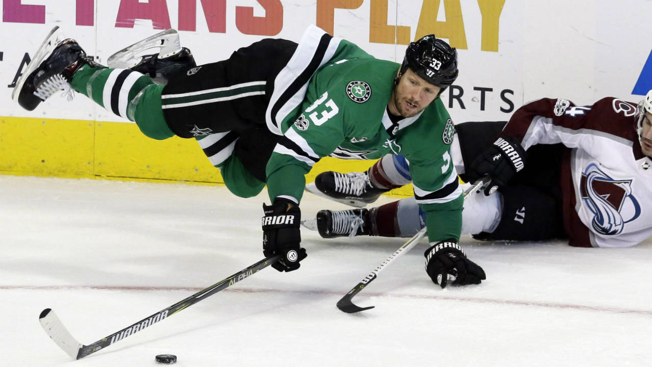 Dallas-Stars-defenceman-Marc-Methot-(33)-reaches-for-the-puck-against-Colorado-Avalanche-right-wing-Nail-Yakupov-(64)-during-the-second-period-of-an-NHL-hockey-game-in-Dallas,-Saturday,-Oct.-14,-2017.-(LM-Otero/AP)