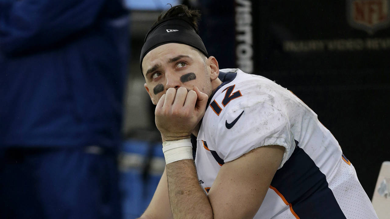 Denver-Broncos-quarterback-Paxton-Lynch-(12)-sits-on-the-bench-during-the-second-half-of-an-NFL-football-game-against-the-Oakland-Raiders-in-Oakland,-Calif.,-Sunday,-Nov.-26,-2017.-(Ben-Margot/AP)