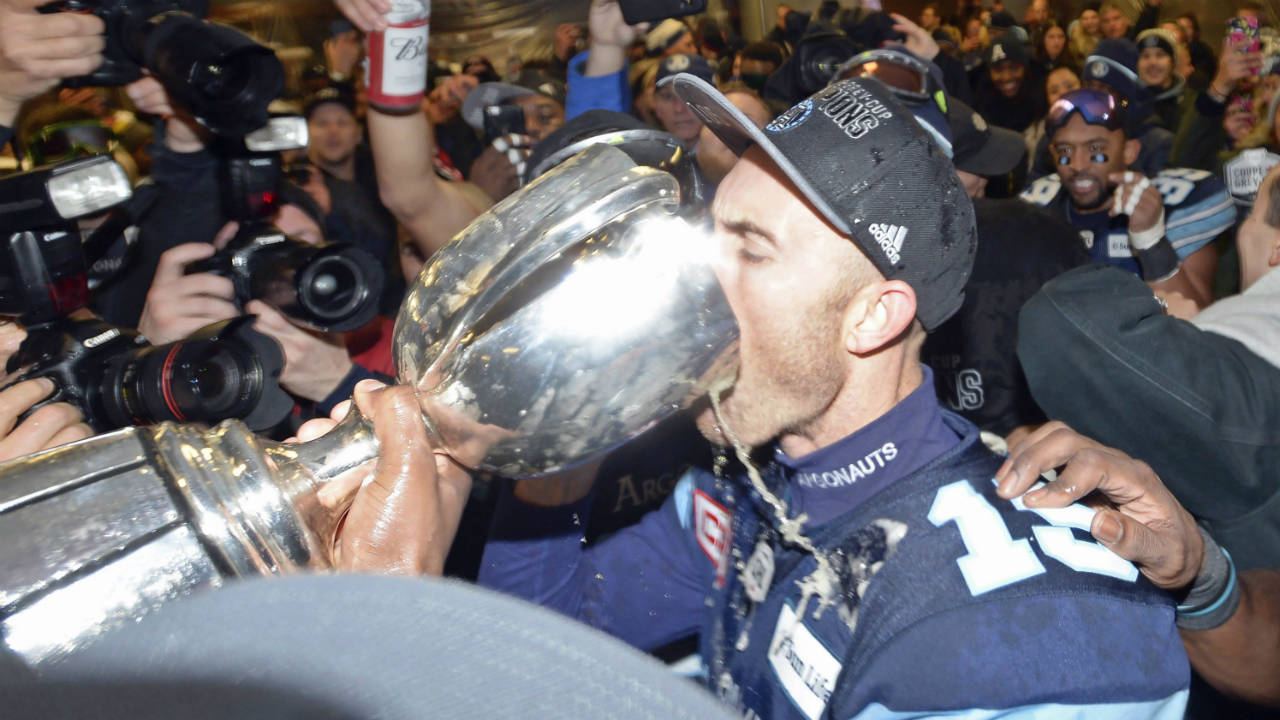 Toronto-Argonauts-quarterback-Ricky-Ray-celebrates-with-the-Grey-Cup-in-the-locker-room-after-defeating-the-Calgary-Stampeders-in-the-105th-Grey-Cup-on-Sunday,-November-26,-2017-in-Ottawa.-(Nathan-Denette/CP)