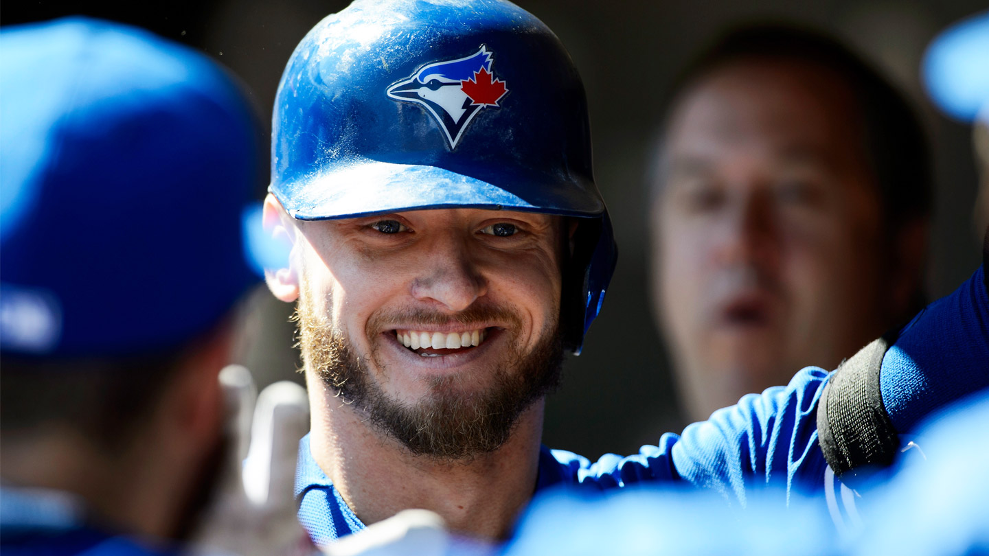 Josh-Donaldson-grins-in-the-dugout-while-celebrating-a-home-run-with-his-Toronto-Blue-Jays-teammates.