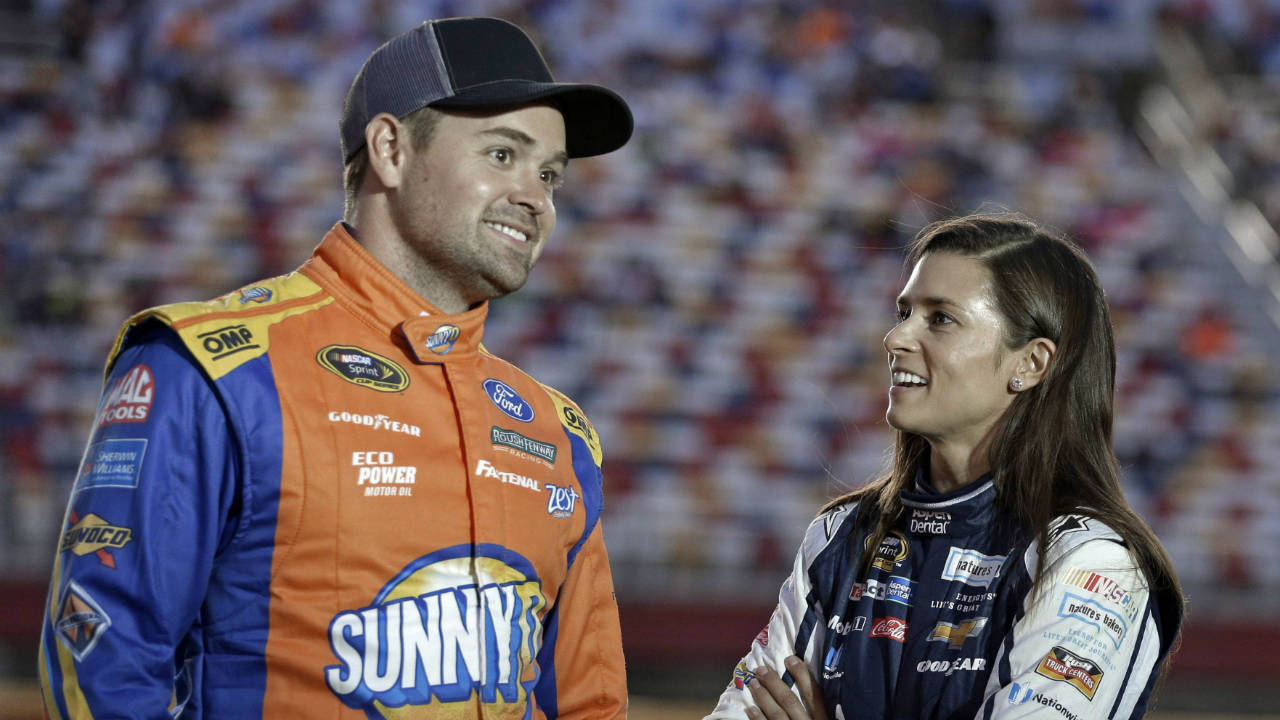 Danica-Patrick,-right,-talks-with-Ricky-Stenhouse-Jr,-before-qualifying-for-Saturday's-NASCAR-Sprint-Cup-series-auto-race-at-Charlotte-Motor-Speedway-in-Charlotte,-N.C.,-Thursday,-Oct.-6,-2016.-(Chuck-Burton/AP)