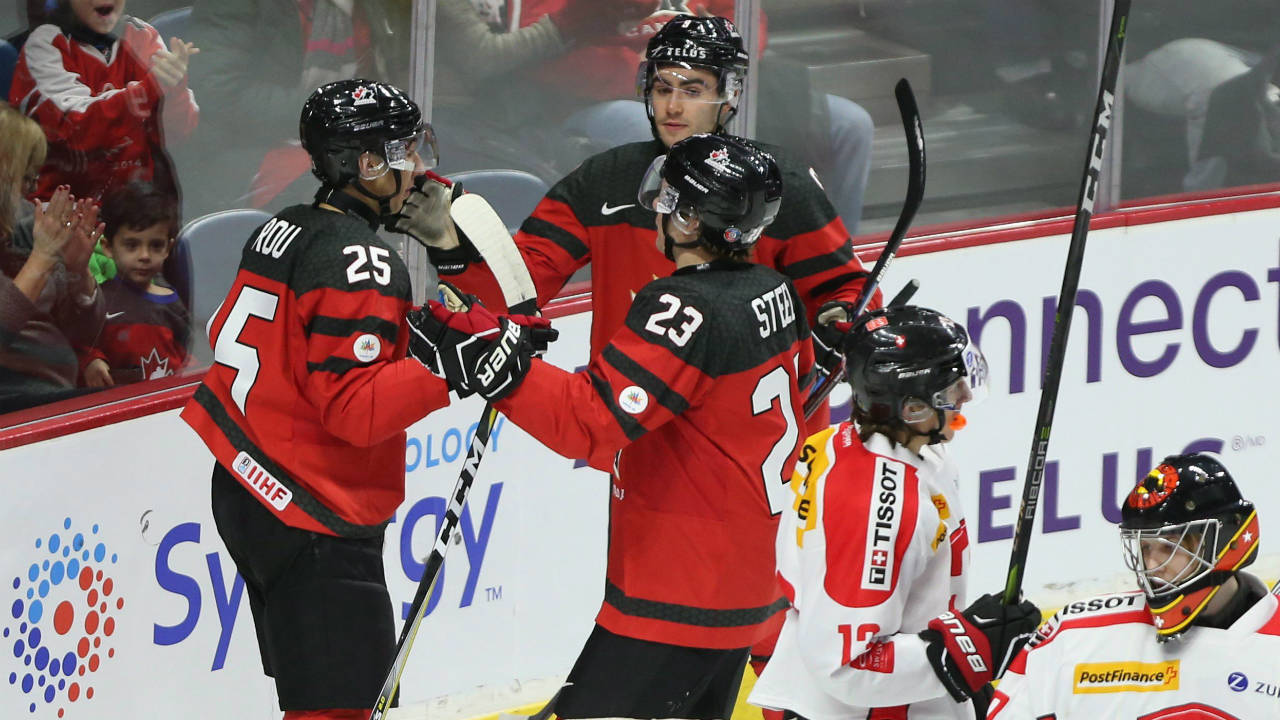 Canada's-Jordan-Kyrou-(25)-celebrates-his-goal-with-teammates-during-first-period-World-Junior-exhibition-hockey-action-against-Switzerland,-in-Hamilton,-Ont.,-on-Friday,-December-22,-2017.-(Peter-Power/CP)