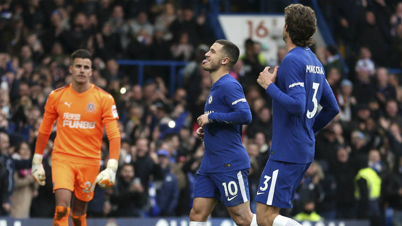 Chelsea's-Eden-Hazard-celebrates-scoring-his-side's-third-goal-of-the-game-during-the-English-Premier-League-soccer-match-between-Chelsea-and-Newcastle-United-at-Stamford-Bridge,-London.-Saturday.-Dec.-2,-2017.-(Steven-Paston/PA-via-AP)