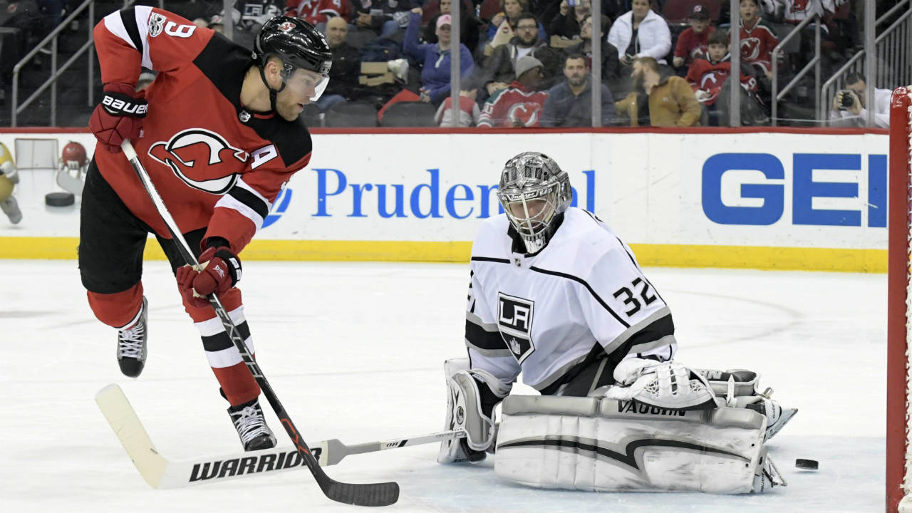 New-Jersey-Devils-left-wing-Taylor-Hall-(9)-scores-a-goal-past-Los-Angeles-Kings-goalie-Jonathan-Quick-(32)-during-the-second-period-of-an-NHL-hockey-game-Tuesday,-Dec.12,-2017,-in-Newark,-N.J.-(Bill-Kostroun/AP)