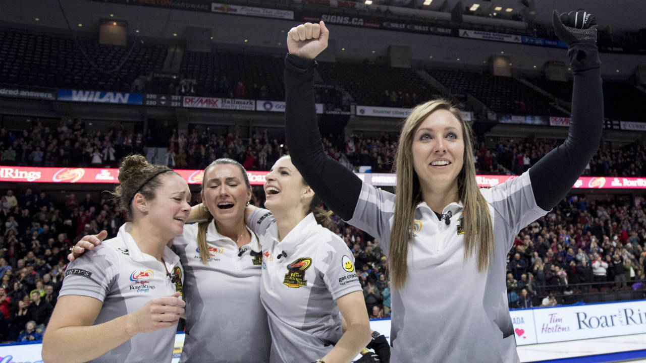Skip-Rachel-Homan-of-Ottawa,-Ont.-pumps-her-fists-as-second-Joanne-Courtney,-third-Emma-Miskew-and-lead-Lisa-Weagle-celebrate-defeating-Team-Carey-in-the-women's-final-at-the-2017-Roar-of-the-Rings-Canadian-Olympic-Trials-in-Ottawa-on-Sunday,-Dec.-10,-2017.-(Justin-Tang/CP)