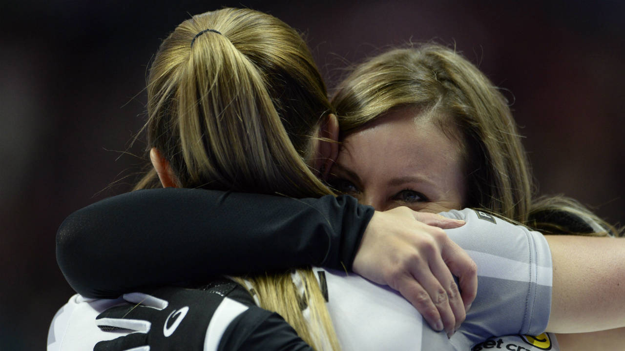 Rachel-Homan,-right,-and-Lisa-Weagle-hug-each-other-after-winning-the-2017-Roar-of-the-Rings-Canadian-Olympic-Trials-in-Ottawa-on-Sunday,-Dec.-10,-2017.-Homan-and-her-Ottawa-based-curling-team-will-represent-Canada-at-the-Winter-Olympics.-(Adrian-Wyld/CP)