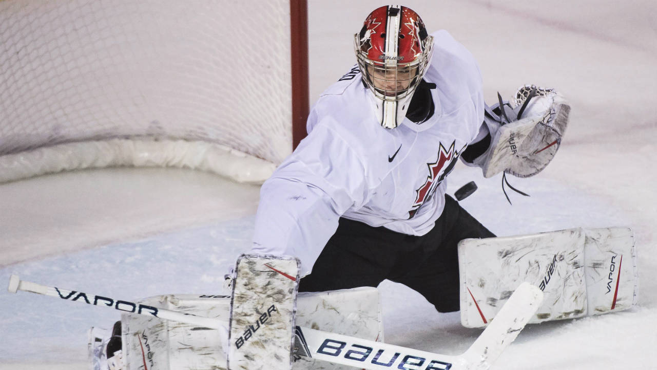 USports-goalie-Michael-DiPietro-(31)-makes-a-save-against-Team-Canada-during-third-period-exhibition-hockey-action-in-preparation-for-the-upcoming-IIHF-World-Junior-Championships-in-St.-Catharines,-Ont.,-on-Thursday,-December-14,-2017.-(Nathan-Denette/CP)