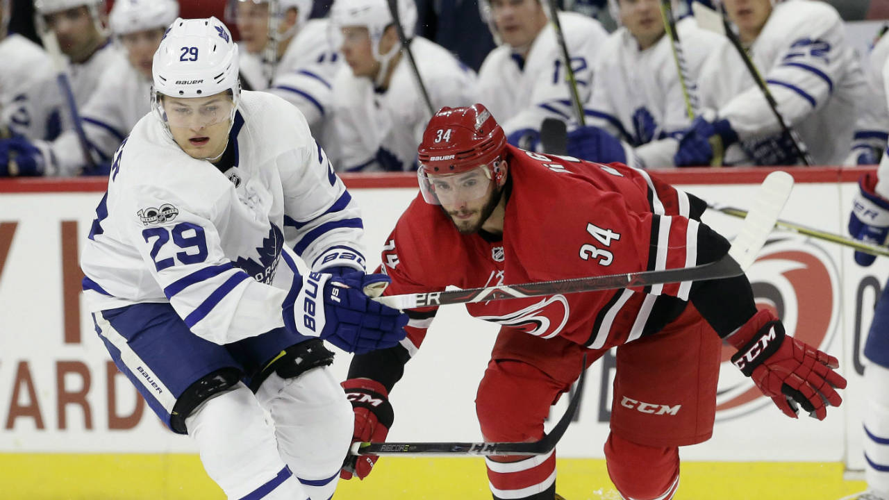 Toronto-Maple-Leafs'-William-Nylander-(29)-and-Carolina-Hurricanes'-Phillip-Di-Giuseppe-(34)-chase-the-puck-during-the-second-period-of-an-NHL-hockey-game-in-Raleigh,-N.C.,-Friday,-Nov.-24,-2017.-(Gerry-Broome/AP)