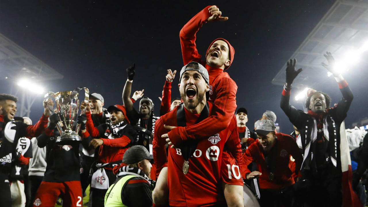 Toronto-FC-Sebastian-Giovinco-jumps-on-Jonathan-Osorio-after-defeating-the-Seattle-Sounders-to-win-the-MLS-Cup-in-Toronto-on-Saturday,-December-9,-2017.-(Mark-Blinch/CP)