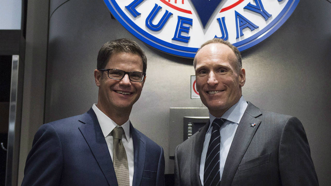 Toronto-Blue-Jays-new-general-manager-Ross-Atkins,-left,-and-Blue-Jays-president-and-CEO-Mark-Shapiro-pose-for-a-photograph-before-a-press-conference-in-Toronto-on-Friday,-December-4,-2015.-(Nathan-Denette/CP)