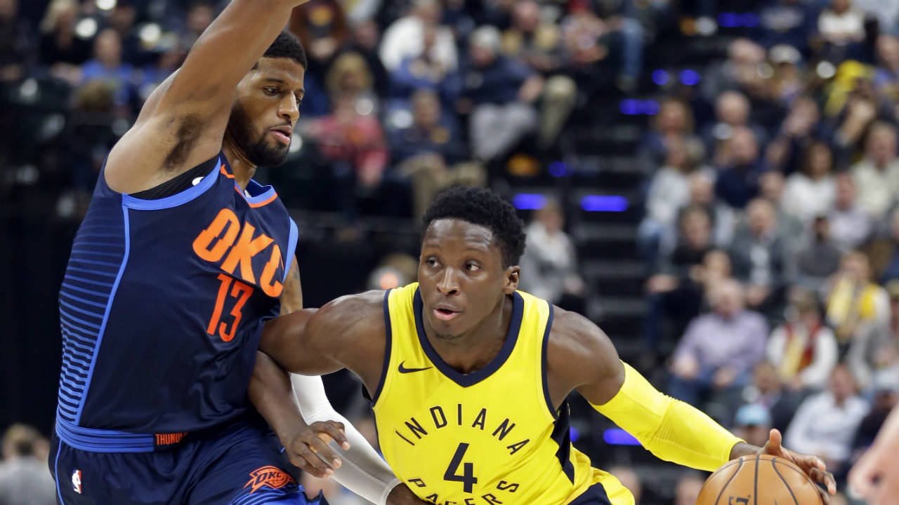 Indiana-Pacers-guard-Victor-Oladipo-(4)-drives-on-Oklahoma-City-Thunder-forward-Paul-George-(13)-during-the-second-half-of-an-NBA-basketball-game-in-Indianapolis,-Wednesday,-Dec.-13,-2017.-The-Thunder-defeated-the-Pacers-100-95.-(Michael-Conroy/AP)