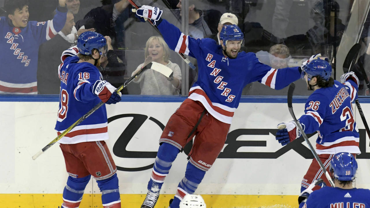 New-York-Rangers-right-wing-Rick-Nash-(61)-celebrates-his-goal-with-defenseman-Marc-Staal-(18)-and-right-wing-Mats-Zuccarello-(36)-during-the-third-period-of-an-NHL-hockey-game-against-the-Los-Angeles-Kings-Friday,-Dec.-15,-2017,-at-Madison-Square-Garden-in-New-York.-(Bill-Kostroun/AP)