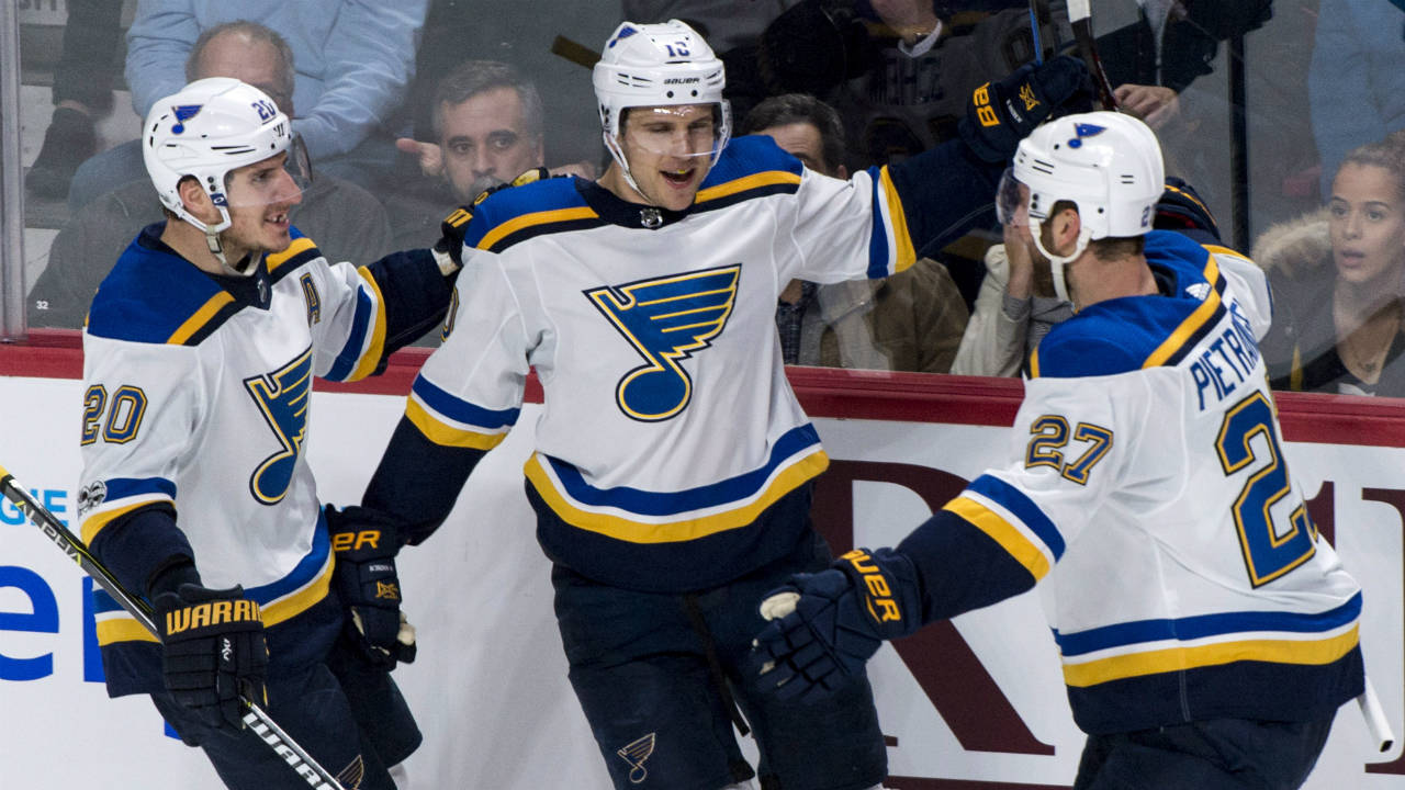 St.-Louis-Blues'-Brayden-Schenn,-centre,-celebrates-his-second-goal-with-teammates-Alexander-Steen,-left,-and-Alex-Pietrangelo-during-second-period-NHL-hockey-action-against-the-Montreal-Canadiens,-in-Montreal-on-Tuesday,-December-5,-2017.-(Paul-Chiasson/CP)