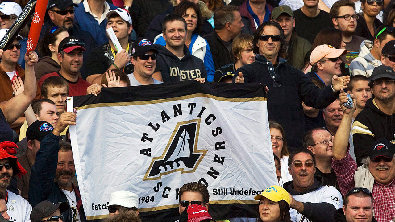 Fans-display-an-Atlantic-Schooners-banner-at-the-Toronto-Edmonton-CFL-game-at-Moncton-Stadium-in-Moncton,-N.B.-on-Sunday,-Sept.-26,-2010.-The-team-was-to-join-the-CFL-in-the-1980s-but-never-played-a-game-because-funding-could-not-be-secured-for-a-stadium.-(Andrew-Vaughan/CP)