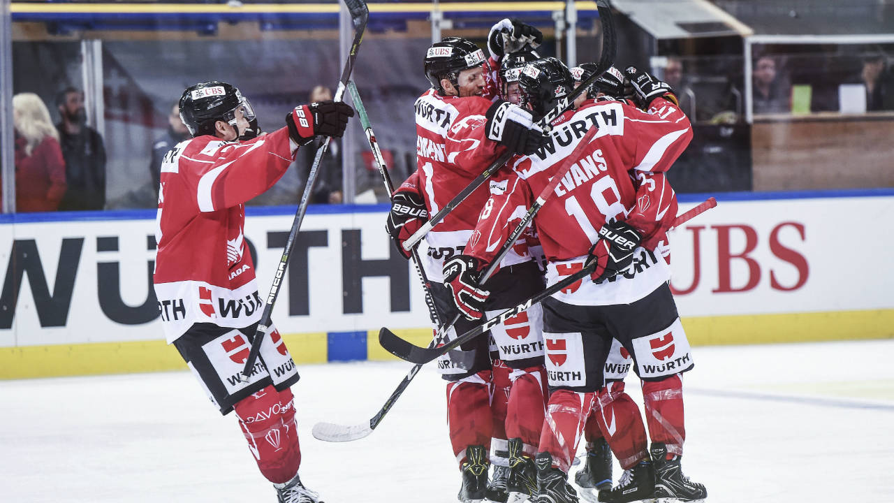 Canada's-team-celebrates-after-scoring-2:0-during-the-final-game-between-Team-Canada-and-Team-Suisse-at-the-91st-Spengler-Cup-ice-hockey-tournament-in-Davos,-Switzerland,-Sunday,-Dec.-31,-2017.-(Melanie-Duchene/Keystone-via-AP)