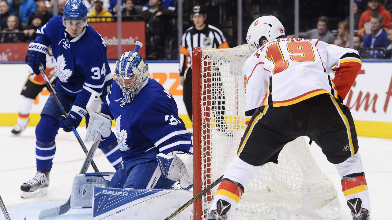 Toronto-Maple-Leafs-goalie-Frederik-Andersen-(31)-makes-a-save-on-Calgary-Flames-left-wing-Matthew-Tkachuk-(19)-as-Toronto-Maple-Leafs-centre-Auston-Matthews-(34)-looks-on-during-first-period-NHL-hockey-action-in-Toronto-on-Monday,-January-23,-2017.-(Nathan-Denette/CP)
