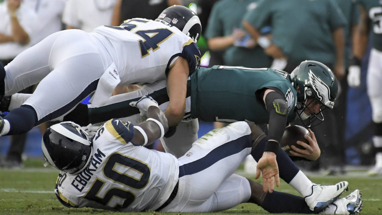 Philadelphia-Eagles-quarterback-Carson-Wentz,-right,-is-tackled-by-Los-Angeles-Rams-linebacker-Samson-Ebukam-(50)-and-inside-linebacker-Bryce-Hager-during-the-second-half-of-an-NFL-football-game-Sunday,-Dec.-10,-2017,-in-Los-Angeles.-(Mark-J.-Terrill/AP)