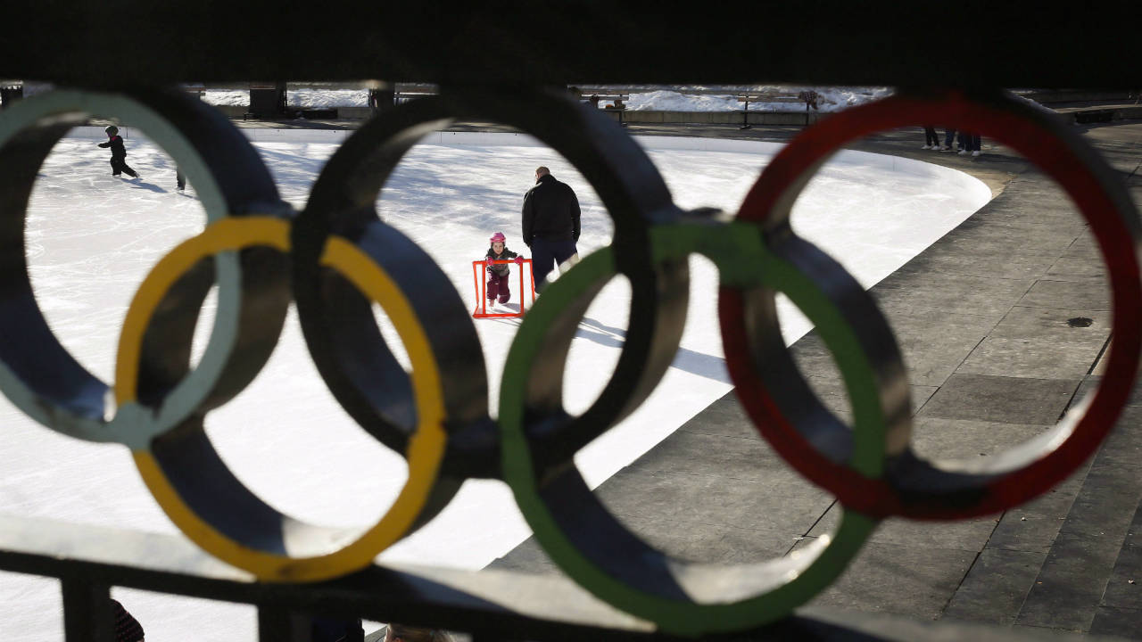 A-young-girl-learns-to-skate-on-the-ice-at-the-1988-Calgary-Olympic-Plaza-on-a-warm-day-in-Calgary,-Alta.,-Sunday,-Jan.-19,-2014.-The-City-of-Calgary-is-being-urged-to-wait-for-more-details-from-the-International-Olympic-Committee-before-deciding-whether-to-bid-for-the-2026-Games.The-17-member-Calgary-Bid-Exploration-Committee-has-concluded-that-it's-feasible-for-the-host-of-the-1988-Winter-Games-to-have-another-turn,-but-recommends-Calgary-take-more-time-to-determine-whether-it's-a-good-idea.-(Jeff-McIntosh/CP)