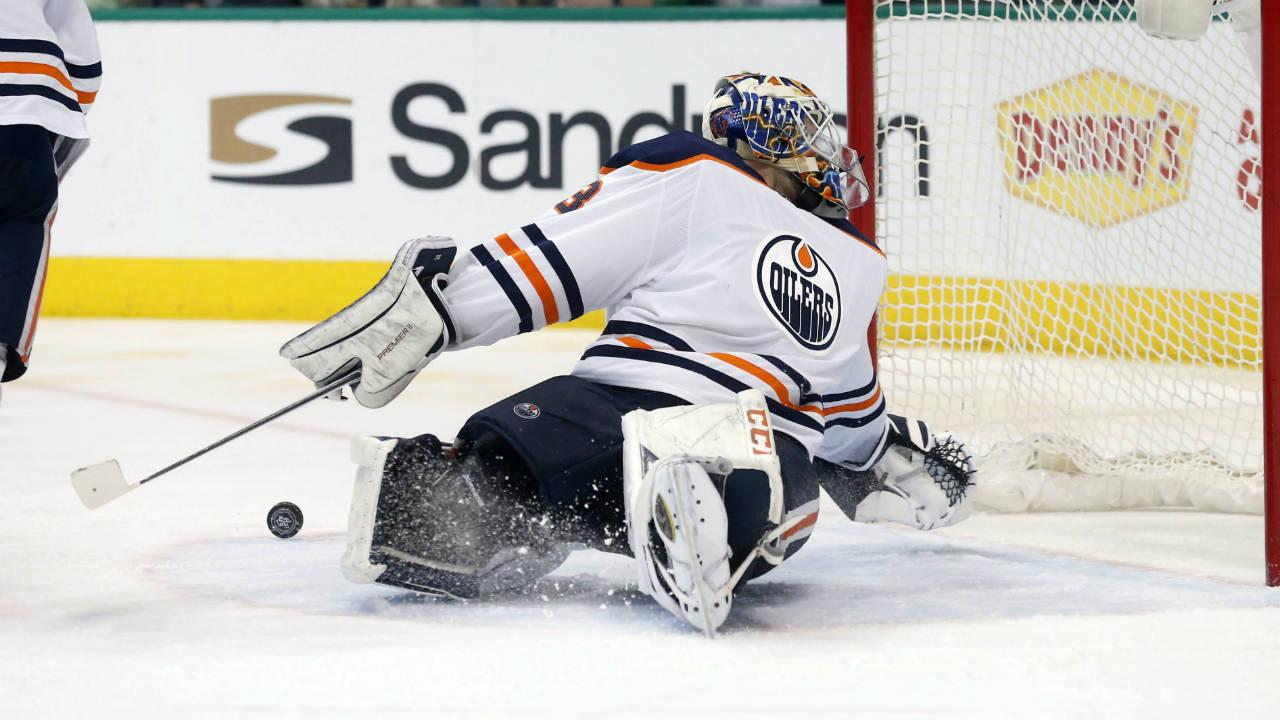 Edmonton-Oilers-goaltender-Cam-Talbot-(33)-has-a-Dallas-Stars-shot-bounce-away-from-the-goal-during-the-second-period-of-an-NHL-hockey-game-in-Dallas,-Saturday,-Jan.-6,-2018.-(Michael-Ainsworth/AP)