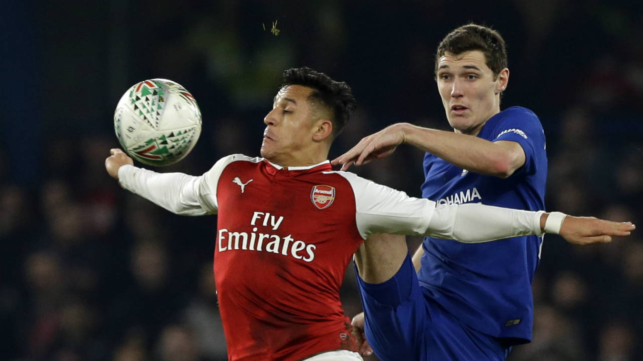 Arsenal's-Alexis-Sanchez,-left,-challenges-for-the-ball-with-Chelsea's-Andreas-Christensen-during-the-English-League-Cup-semifinal,-first-leg,-soccer-match-between-Chelsea-and-Arsenal-at-Stamford-Bridge-stadium-in-London,-Wednesday,-Jan.-10,-2018.-(Alastair-Grant/AP)