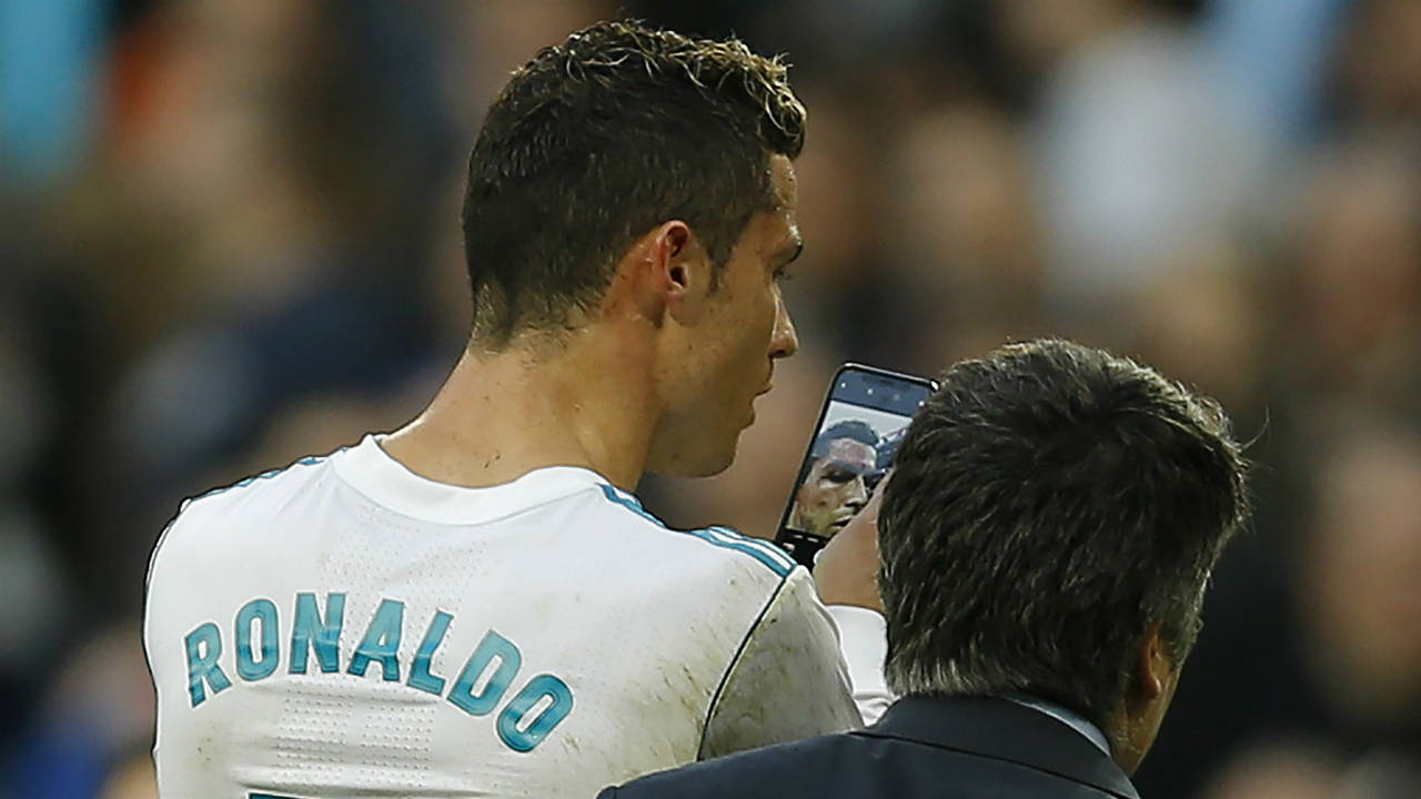 Real-Madrid's-Cristiano-Ronaldo-leaves-the-pitch-as-he-uses-a-phone-to-look-at-himself-while-bleeding-from-his-forehead-during-a-Spanish-La-Liga-soccer-match-between-Real-Madrid-and-Deportivo-Coruna-at-the-Santiago-Bernabeu-stadium-in-Madrid,-Sunday,-Jan.-21,-2018.-Ronaldo-scored-twice-in-Real-Madrid's-7-1-victory.-(Francisco-Seco/AP)